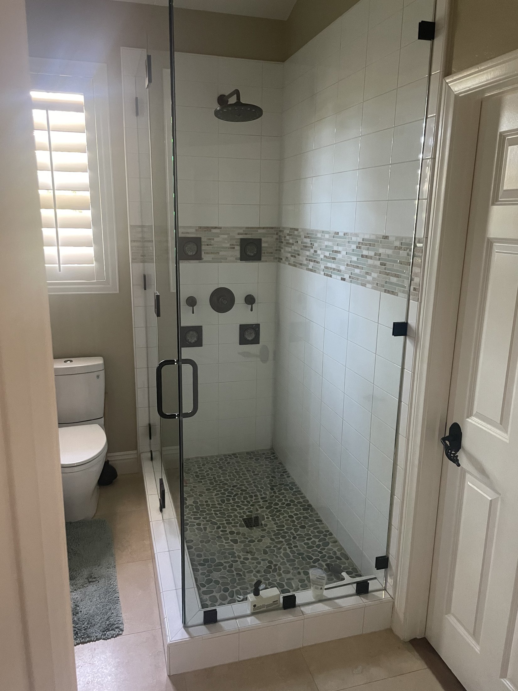Full bathroom remodel with tiled shower and modern vanity in Raleigh, NC