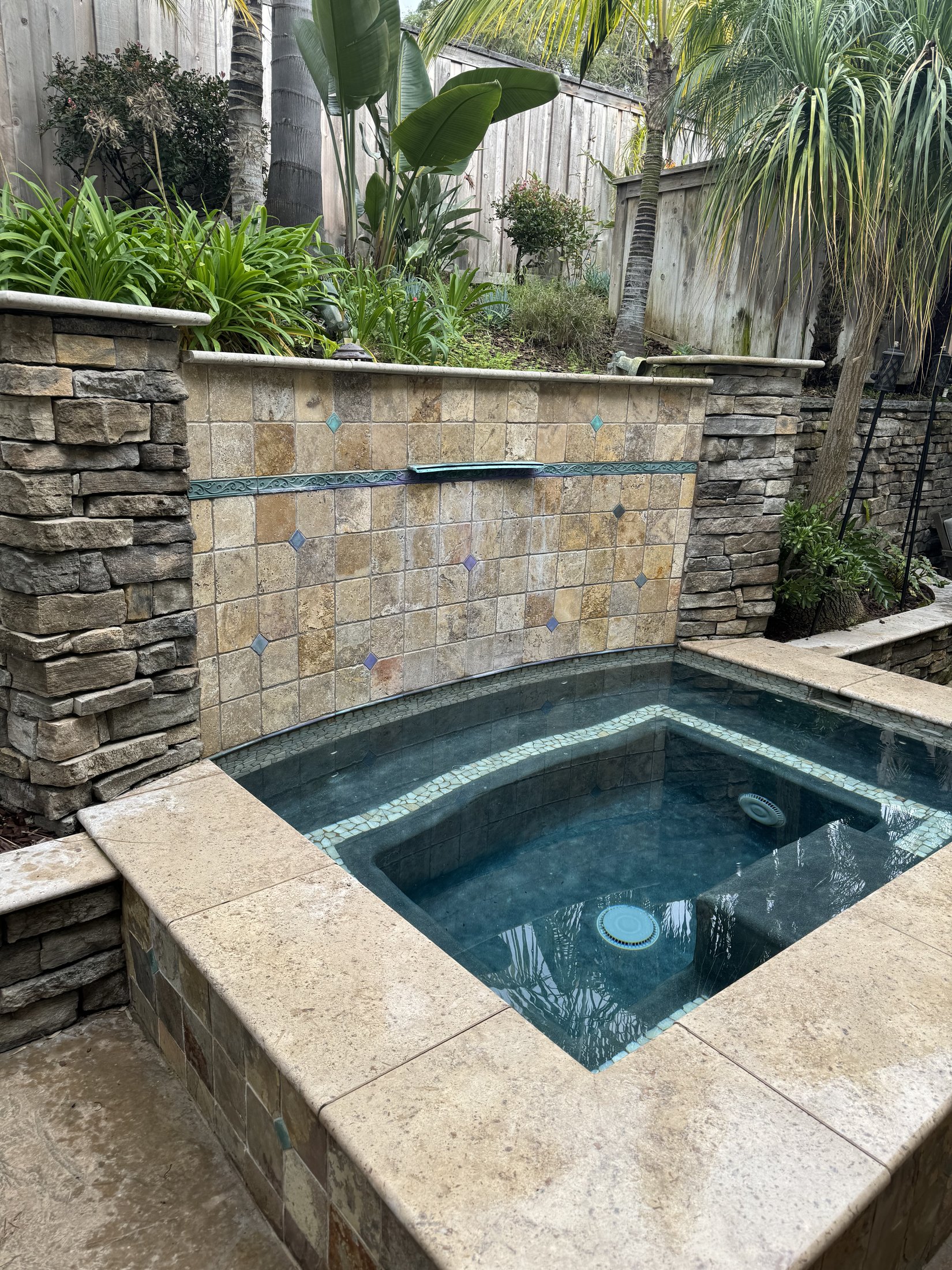 Outdoor deck construction with stone accents at a Raleigh, NC home